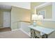 Welcoming hallway featuring neutral walls, a decorative table, and a bright lamp creating an inviting space at 213 Meadow Fox Rd, Holly Springs, NC 27540