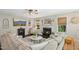 Spacious living room with a fireplace, large windows, and neutral color scheme at 213 Meadow Fox Rd, Holly Springs, NC 27540