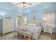 Inviting main bedroom with vaulted ceilings, neutral decor, and soft lighting at 213 Meadow Fox Rd, Holly Springs, NC 27540