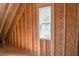 Attic framing showcasing sloped ceilings and a window at 2305 Ballywater Lea Way, Wake Forest, NC 27587