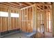 Unfinished bathroom with wall studs, open ceiling, and fixtures at 2305 Ballywater Lea Way, Wake Forest, NC 27587