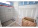 Modern bathroom featuring unfinished cabinets and tiled shower with a bench at 2305 Ballywater Lea Way, Wake Forest, NC 27587
