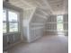 Unfinished bonus room featuring dormer and windows with nice view; customize to your liking at 2305 Ballywater Lea Way, Wake Forest, NC 27587