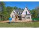New construction home featuring a classic design and situated on a lot surrounded by mature trees at 2305 Ballywater Lea Way, Wake Forest, NC 27587