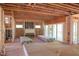 Spacious room with wall studs, open ceiling, fireplace, and sliding glass doors at 2305 Ballywater Lea Way, Wake Forest, NC 27587