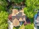 Aerial view of the roof with solar panels, backyard patio and beautiful landscape at 262 Windgate Dr, Clayton, NC 27527