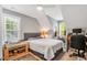 Cozy bedroom with neutral tones, a comfortable bed, and natural light at 262 Windgate Dr, Clayton, NC 27527