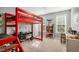 Playful bedroom featuring a bunk bed, carpet floors, and windows, a cozy and functional space at 262 Windgate Dr, Clayton, NC 27527