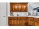 Kitchen featuring dark wood cabinets, white countertops, and stainless steel hardware at 262 Windgate Dr, Clayton, NC 27527