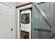 Laundry closet showcasing stacked washer and dryer with a decorative barn door at 262 Windgate Dr, Clayton, NC 27527