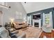 Bright living room features a fireplace, high ceilings, and hardwood flooring at 262 Windgate Dr, Clayton, NC 27527