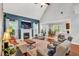 Spacious living room with a fireplace, high ceilings, and an open floor plan leading to the dining area at 262 Windgate Dr, Clayton, NC 27527