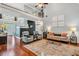 Open-concept living room featuring hardwood floors, fireplace, and lots of natural light at 262 Windgate Dr, Clayton, NC 27527
