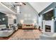 Spacious living room with vaulted ceiling, fireplace, hardwood floors and an open layout at 262 Windgate Dr, Clayton, NC 27527