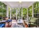 Bright sunroom with large windows providing beautiful views and comfortable seating at 262 Windgate Dr, Clayton, NC 27527