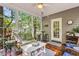 Cozy sunroom with plenty of windows and comfortable seating at 262 Windgate Dr, Clayton, NC 27527