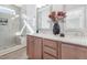 Elegant bathroom with double vanity, quartz countertop, and walk-in shower with bench at 3022 White Rail Dr, Fuquay Varina, NC 27526