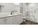 Modern bathroom with dual sinks, quartz counters, and shower-tub combination at 3022 White Rail Dr, Fuquay Varina, NC 27526