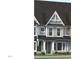 Charming two-story home with gray siding, white trim, and a well-manicured lawn at 3022 White Rail Dr, Fuquay Varina, NC 27526