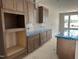 Well-lit kitchen showcasing wood cabinetry, a white tile backsplash, and a spacious island at 3022 White Rail Dr, Fuquay Varina, NC 27526
