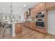 Modern kitchen featuring stainless steel appliances, granite countertops, and ample cabinetry at 3022 White Rail Dr, Fuquay Varina, NC 27526