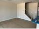 Open-concept living area with staircase and natural light at 3022 White Rail Dr, Fuquay Varina, NC 27526
