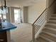 Open-concept living area with staircase and natural light at 3022 White Rail Dr, Fuquay Varina, NC 27526