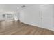 Spacious and well-lit living room featuring wood floors and neutral paint at 3022 White Rail Dr, Fuquay Varina, NC 27526