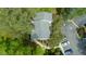 Aerial view of a home with mature trees, private parking, and manicured landscaping at 304 Cedarwood Ln, Carrboro, NC 27510