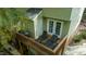 Inviting deck with outdoor seating and a grill, perfect for relaxing or entertaining at 304 Cedarwood Ln, Carrboro, NC 27510