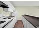 Efficient kitchen with white cabinets, appliances, and plenty of counter space for meal preparation at 304 Cedarwood Ln, Carrboro, NC 27510
