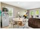 Cozy dining area next to a living room featuring ample natural light at 304 Cedarwood Ln, Carrboro, NC 27510