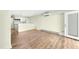 Spacious room with hardwood flooring and kitchen in the background at 304 Cedarwood Ln, Carrboro, NC 27510