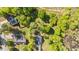 Aerial view showcasing a house with verdant surroundings, emphasizing the property's peaceful setting at 308 Thorndale Dr, Dunn, NC 28334