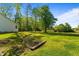 Spacious backyard featuring a creek and lush greenery, offering a serene and natural environment at 308 Thorndale Dr, Dunn, NC 28334