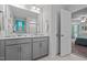 Bathroom features gray vanity with dual sinks and a window with blue valance at 308 Thorndale Dr, Dunn, NC 28334