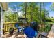 Outdoor deck furnished with a grill and seating, ideal for outdoor cooking and relaxation at 308 Thorndale Dr, Dunn, NC 28334