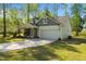 Charming home featuring a two-car garage and inviting entrance with well-maintained landscaping at 308 Thorndale Dr, Dunn, NC 28334