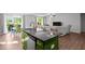 Modern kitchen island, complete with dishwasher, is central to this open-concept space, featuring a double sink at 308 Thorndale Dr, Dunn, NC 28334