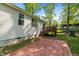 Outdoor patio with brick pavers and wooden deck, offering a great space for relaxation and outdoor living at 308 Thorndale Dr, Dunn, NC 28334