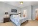Cozy bedroom featuring a queen size bed, carpet, and bedside tables at 311 Providence Glen Dr, Chapel Hill, NC 27514