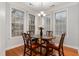 Dining area with a round wooden table, leather chairs, and natural lighting at 311 Providence Glen Dr, Chapel Hill, NC 27514