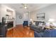 Cozy living room showcasing hardwood floors, a fireplace, and neutral-toned furniture at 311 Providence Glen Dr, Chapel Hill, NC 27514