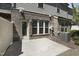 Backyard featuring concrete patio and exterior brick facade at 317 Castle Rock Ln, Cary, NC 27519