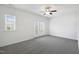 Bedroom with neutral carpet, ceiling fan, natural light, and access to balcony at 317 Castle Rock Ln, Cary, NC 27519