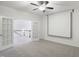 Bonus room featuring French doors, neutral carpet, and drop down projector screen at 317 Castle Rock Ln, Cary, NC 27519