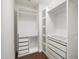 Custom walk-in closet with ample shelving and drawer space for organization at 317 Castle Rock Ln, Cary, NC 27519