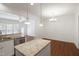 Bright kitchen with granite countertops, stainless appliances, and a seamless transition to the dining area at 317 Castle Rock Ln, Cary, NC 27519