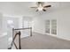 Upstairs loft area with carpet flooring and staircase at 317 Castle Rock Ln, Cary, NC 27519