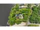 Aerial view of the waterfront property with mature trees and a private setting on the lake at 373 & 375 Sagamore Dr, Louisburg, NC 27549
